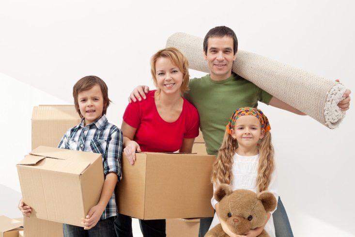 Family-with-children-moving-house-with-boxes-and-a-teddy
